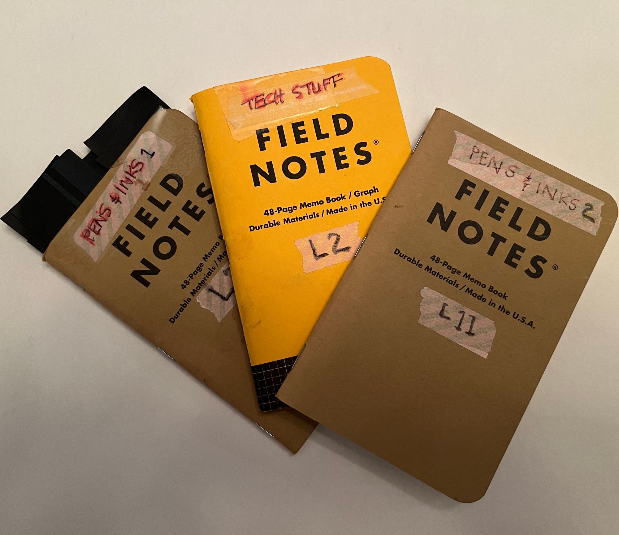 3 Field Notes memo books labeled Pens and Inks 1,2 and a third labeled Tech Stuff