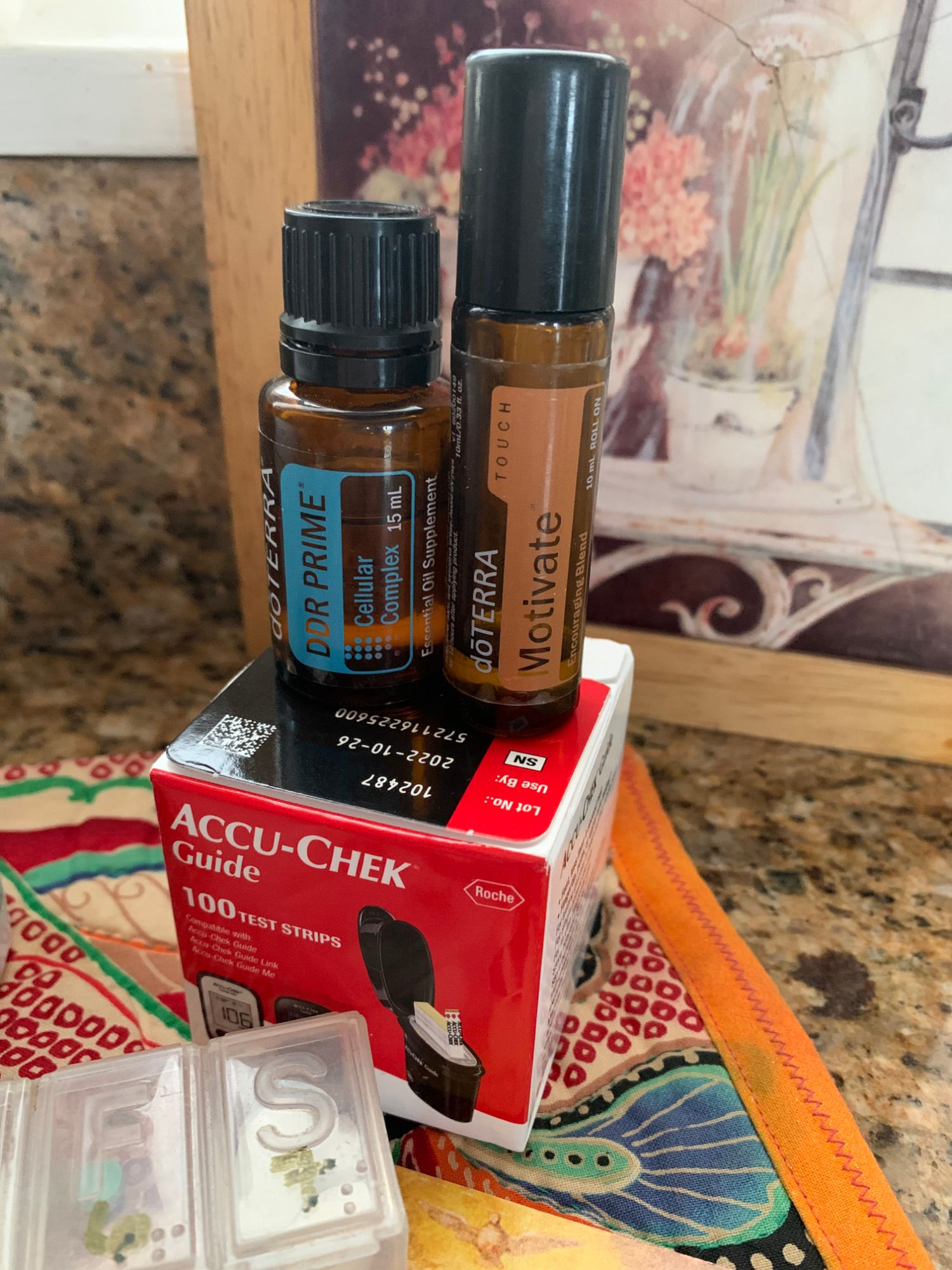 Two brown bottles standing on Accu-Chek Guide Box