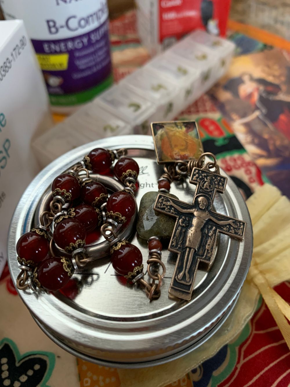 Close up of ornate rosary with cross and emblem